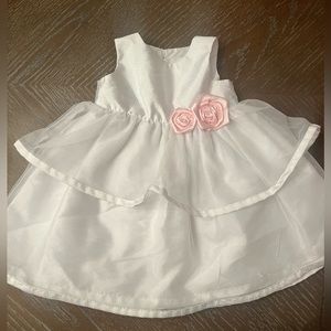 White dress with pink floral embellishments